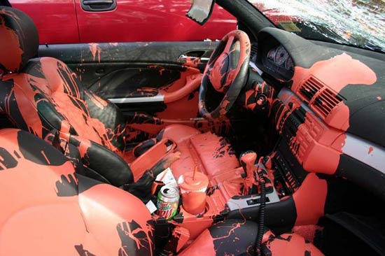 car soaked with red house paint